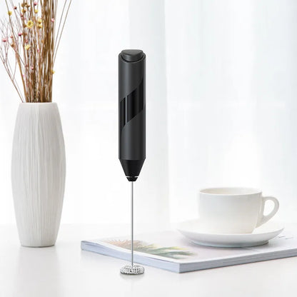 Electric milk frother in use