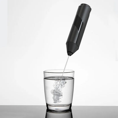 Electric milk frother whisking milk foam