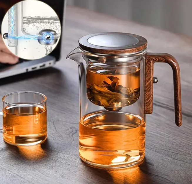 Glass brew teapot pouring tea